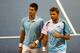 Novak Djokovic and Stan Wawrinka during their first-round doubles match at the 2014 Rogers Cup.