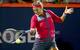 Victoria Azarenka readies to hit a forehand during an evening match at the 2014 Rogers Cup in Montreal.