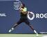 Gael Monfils rips a backhand during a match against Novak Djokovic at the 2014 Rogers Cup in Toronto.
