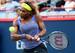 Serena Williams hits a backhand during Rogers Cup match.