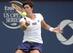 Carla Suarez Navarro hits a forehand during her upset win over Maria Sharapova at the 2014 Rogers Cup in Montreal.