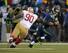 Glenn Dorsey rushes Russell Wilson in the NFC title game.