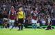 BIRMINGHAM, ENGLAND - AUGUST 23: Referee Mike Dean turns away after showing the red card to Mike Williamson (R) of Newcastle United during the Barclays Premier League match between Aston Villa and Newcastle United at Villa Park on August 23, 2014 in Birm