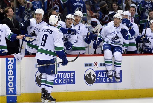 Canucks' business boss works the bench with minor hockey team in