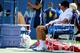 Novak Djokovic tries to cool off during a match against Kei Nishikori at the 2014 U.S. Open.