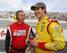 Joey Logano (right) shares a laugh with ESPN's Vince Welch