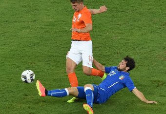 Mattia Destro goes in hard against the Netherlands' Joel Veltman in September's friendly.