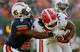 Auburn S Jermaine Whitehead and Georgia RB Todd Gurley