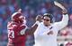 Arkansas guard Sebastian Tretola celebrates with head coach Bret Bielema