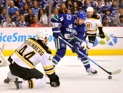 Martins Karsums of the Boston Bruins skates against the New Jersey