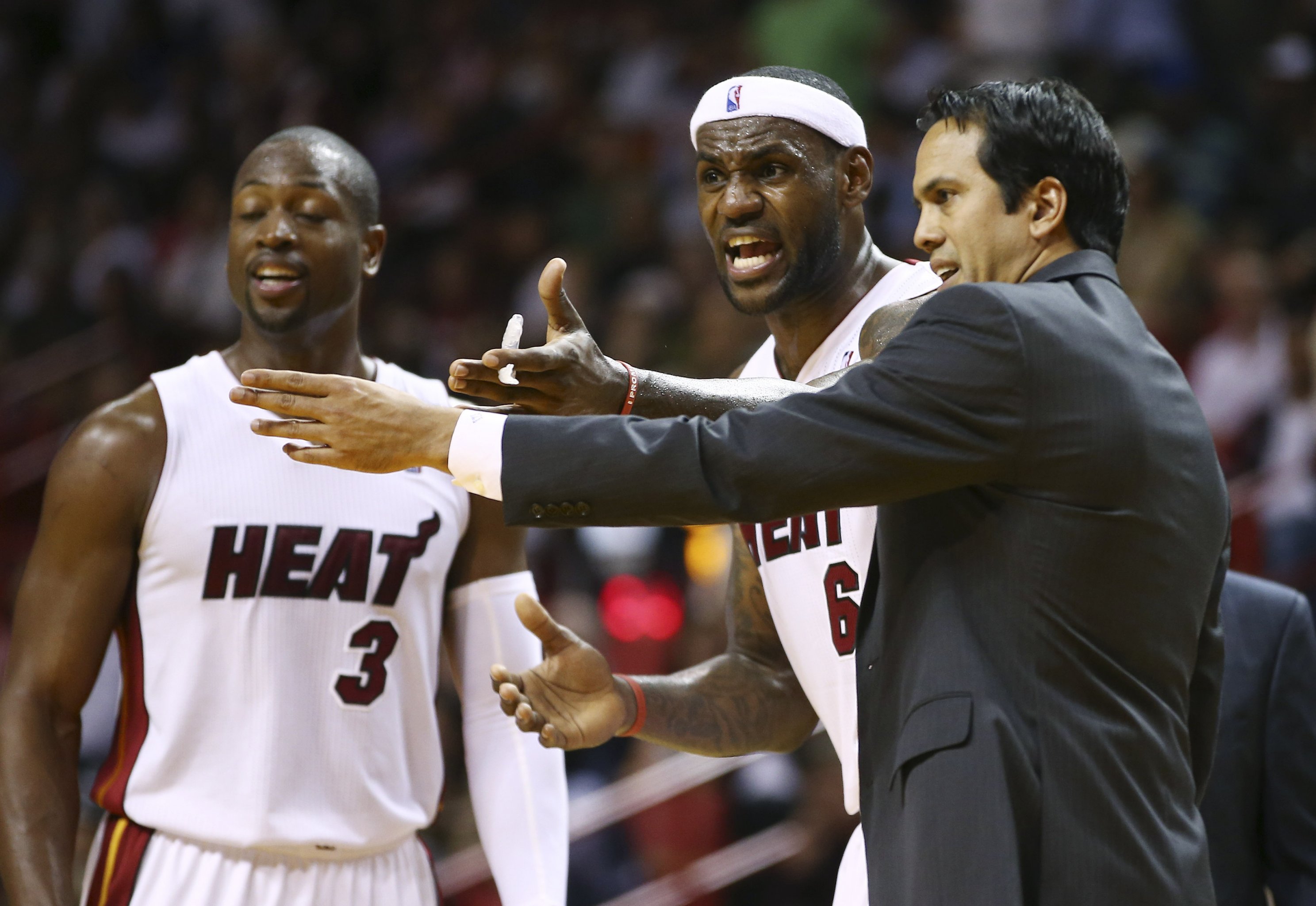 Miami Heat head coach Erik Spoelstra, right, presents a 2011-12