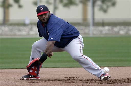 Boston Red Sox catcher CHRISTIAN VAZQUEZ talks with relief pitcher JUNICHI  TAZAWA