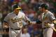 Backup catcher Josh Phegley is greeted by Eric Sogard after scoring.