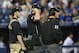 MLB umpires consult to review a call on the field.