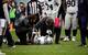 Raiders defensive end Denico Autry getting checked by team physicians