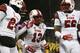 Utah LB Gionni Paul (center)
