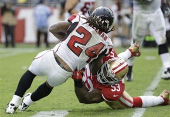 Linebacker NaVorro Bowman (53) was an integral part in holding Falcons running back Devonta Freeman (24) to a minimal Week 9 effort.