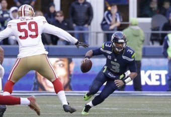 Can linebacker Aaron Lynch (left) find success rushing quarterback Russell Wilson (right) in Week 11?