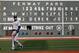 Those letters and numbers at the Fenway Park scoreboards don't go up on their own