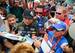 Jeff Gordon (center, in black hat) was mobbed like a true rock star at Homestead.