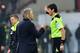 Roberto Mancini argues with the referee after being sent to the stands.