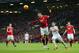 Smalling with a clearing header against Swansea City.