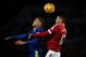 Chris Smalling and Jamie Vardy in an aerial duel.