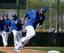 Lorenzo Cain glides around first base at the Royals spring camp in Surprise, Arizona.