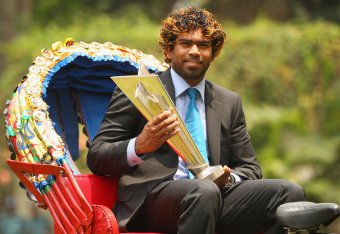 Sri Lanka skipper Lasith Malinga poses with the trophy after his team's triumph in 2014.