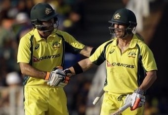 David Warner (right) needs to get back to the top of Australia's batting order.