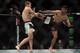 Yair Rodriguez kicks Dan Hooker.