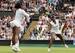 Serena Willams and Venus Williams attack the ball during a doubles match at Wimbledon 2016.