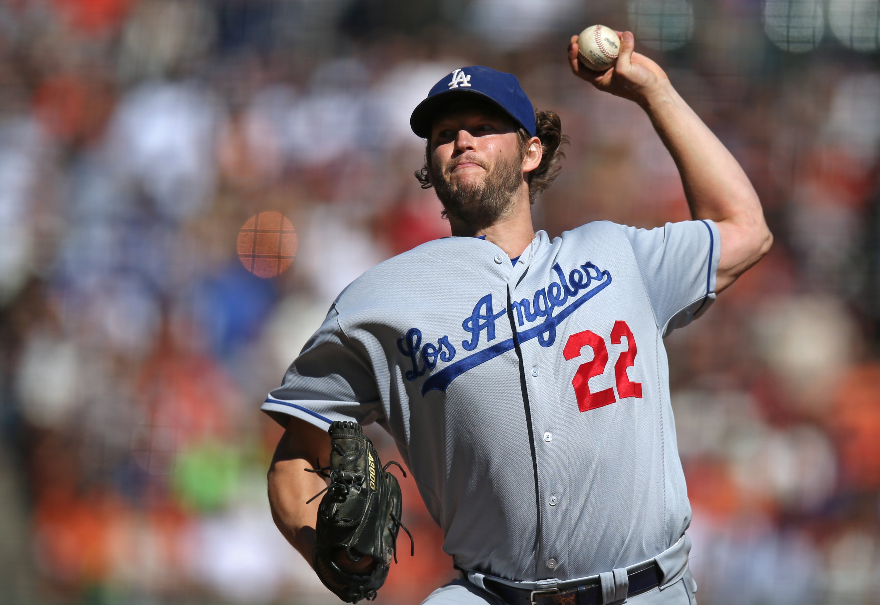 Los Angeles Dodgers' Andrew Toles, right, scores past Washington Nationals  relief pitcher Blake Treinen on a single by Chase Utley during the eighth  inning in Game 4 of baseball's National League Division