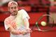 Lucas Pouille hits a backhand during a match in Vienna , Austria.