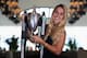 Dominika Cibulkova poses with the trophy after winning the 2016 WTA Tour Finals in Singapore.