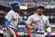 Outfielders Curtis Granderson (left) and Yoenis Cespedes.