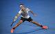 Roger Federer slides to make a play on the ball during a match at the 2017 Australian Open.