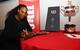 Serena Williams signs Wilson racquets after winning her 23rd Grand Slam title at the 2017 Australian Open.