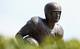 A statue of Doak Walker stands on the campus of Southern Methodist University.