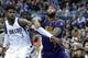 Nerlens Noel battles DeMarcus Cousins down low.