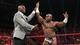 Titus O'Neil congratulates Apollo Crews.