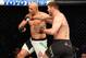 Stipe Miocic (right) hits Junior dos Santos