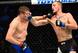Jason Knight (right) hits Chas Skelly