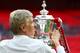 Arsene Wenger celebrates with the FA Cup.