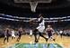 Boston's Jalen Brown (C) flies in for the reverse layup.