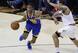 Golden State's Patrick McCaw (L) drives around Cleveland's Deron Williams during the 2017 Finals.