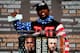 Floyd Mayweather holding up a nine-figure check on the first day of the World Tour.