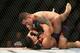 Chris Weidman (top) controls Kelvin Gastelum