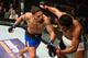 Eryk Anders (left) fells Rafael Natal.