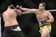Junior Albini (right) hits Tim Johnson